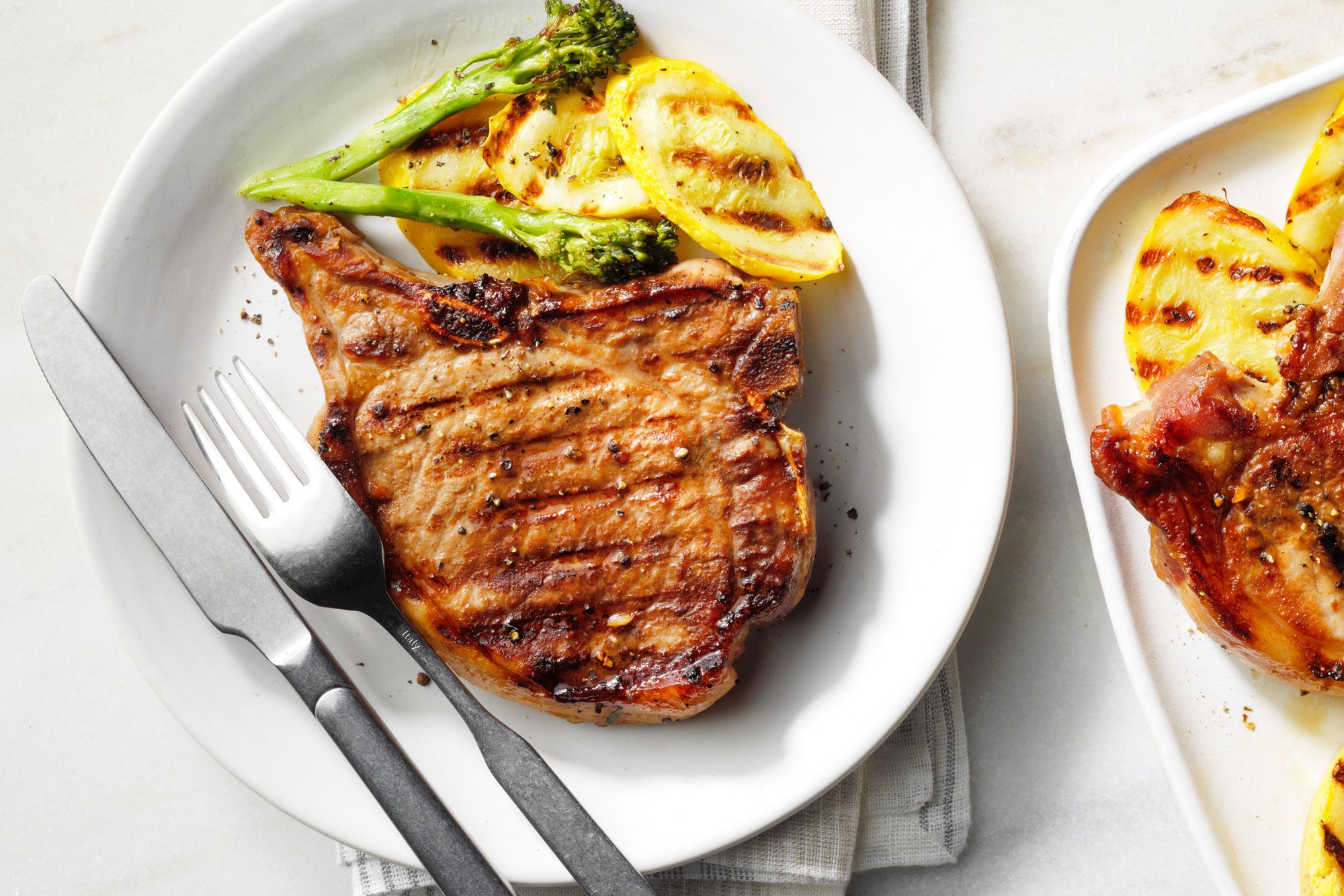 Delicious plate of Simple Pork Chop Marinade served with fork and knife
