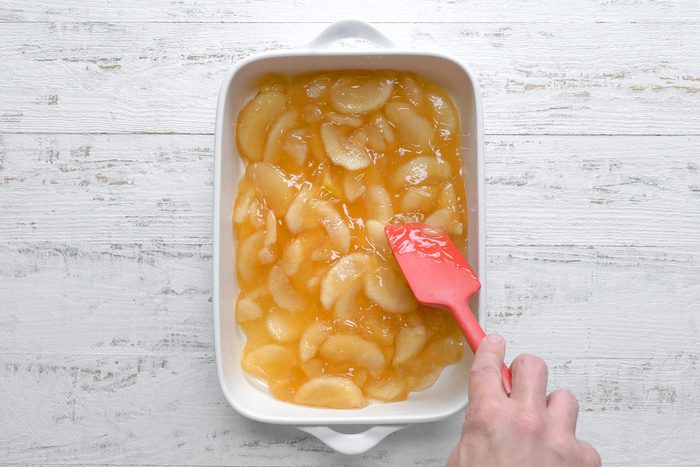 overhead shot of apple pie filling in the baking dish