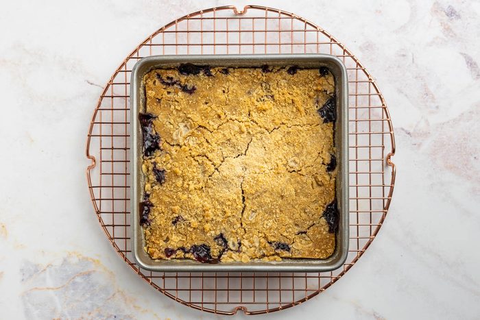 Taste of Home blueberry crisp recipe photo of recipe finished, out of the oven and on a cooling rack.