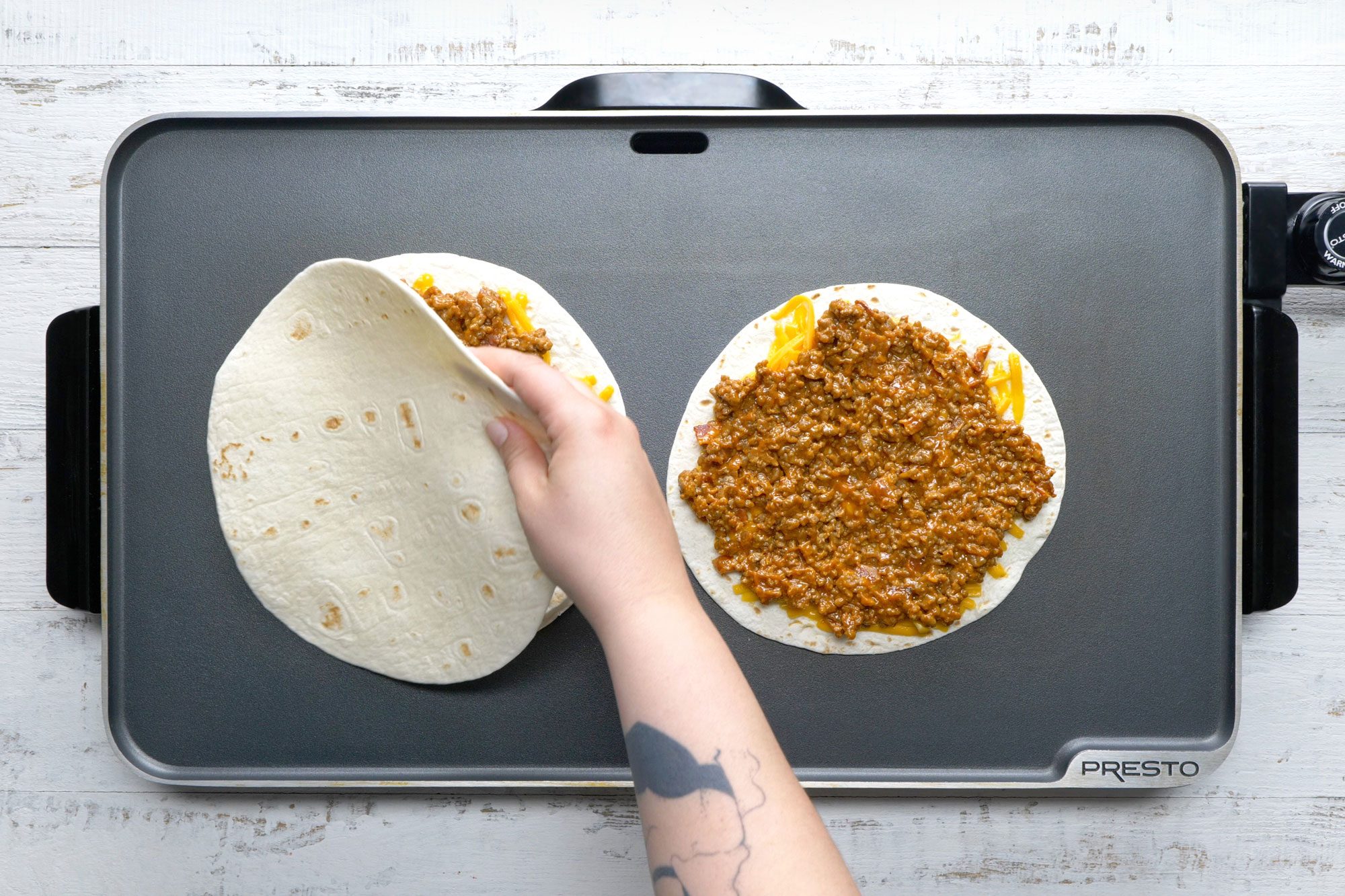 overhead shot of tortilla topped on beef mixture