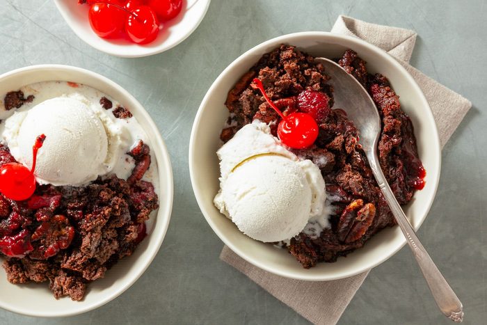 Chocolate cherry dump cake served with ice cream and cherry
