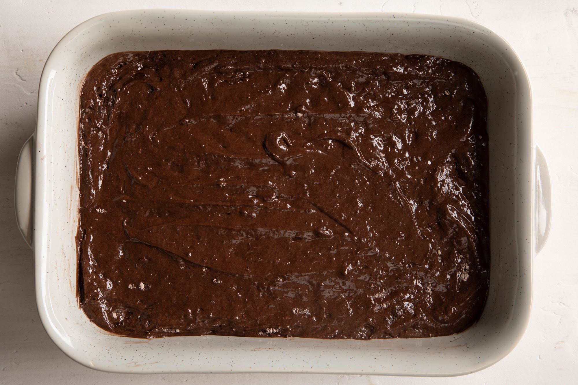 Chocolate Dump Cake mix in a rectangular baking dish