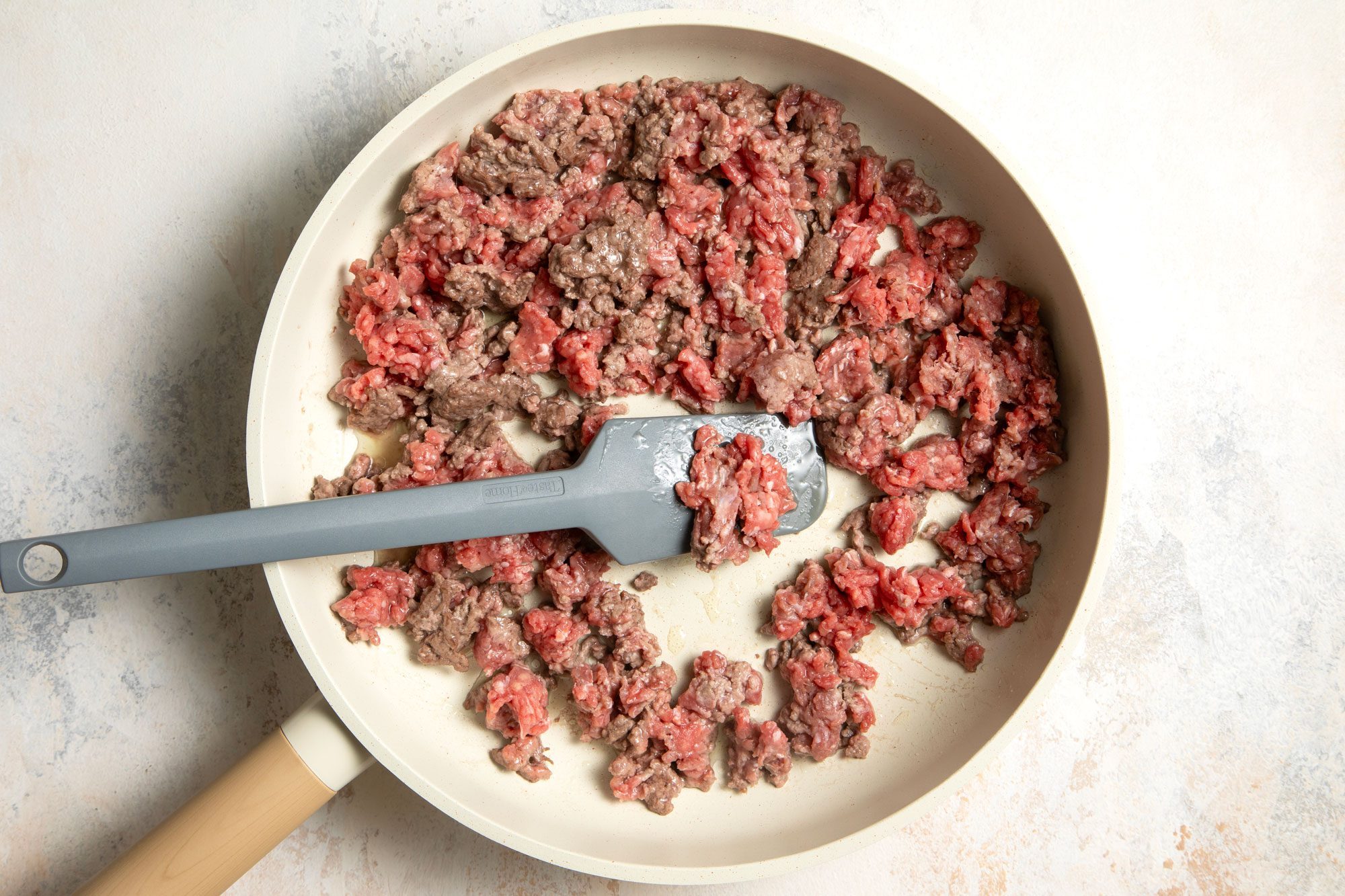 Ground beef in a skillet with spatula