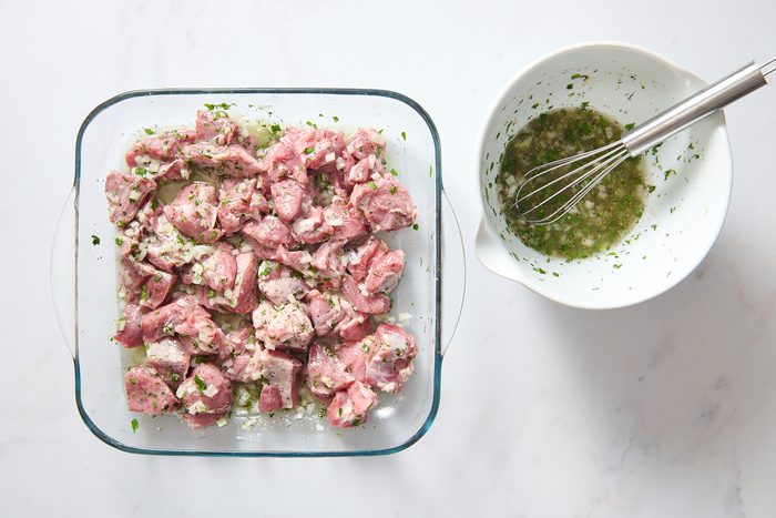 Marinating the lamb in a shallow dish
