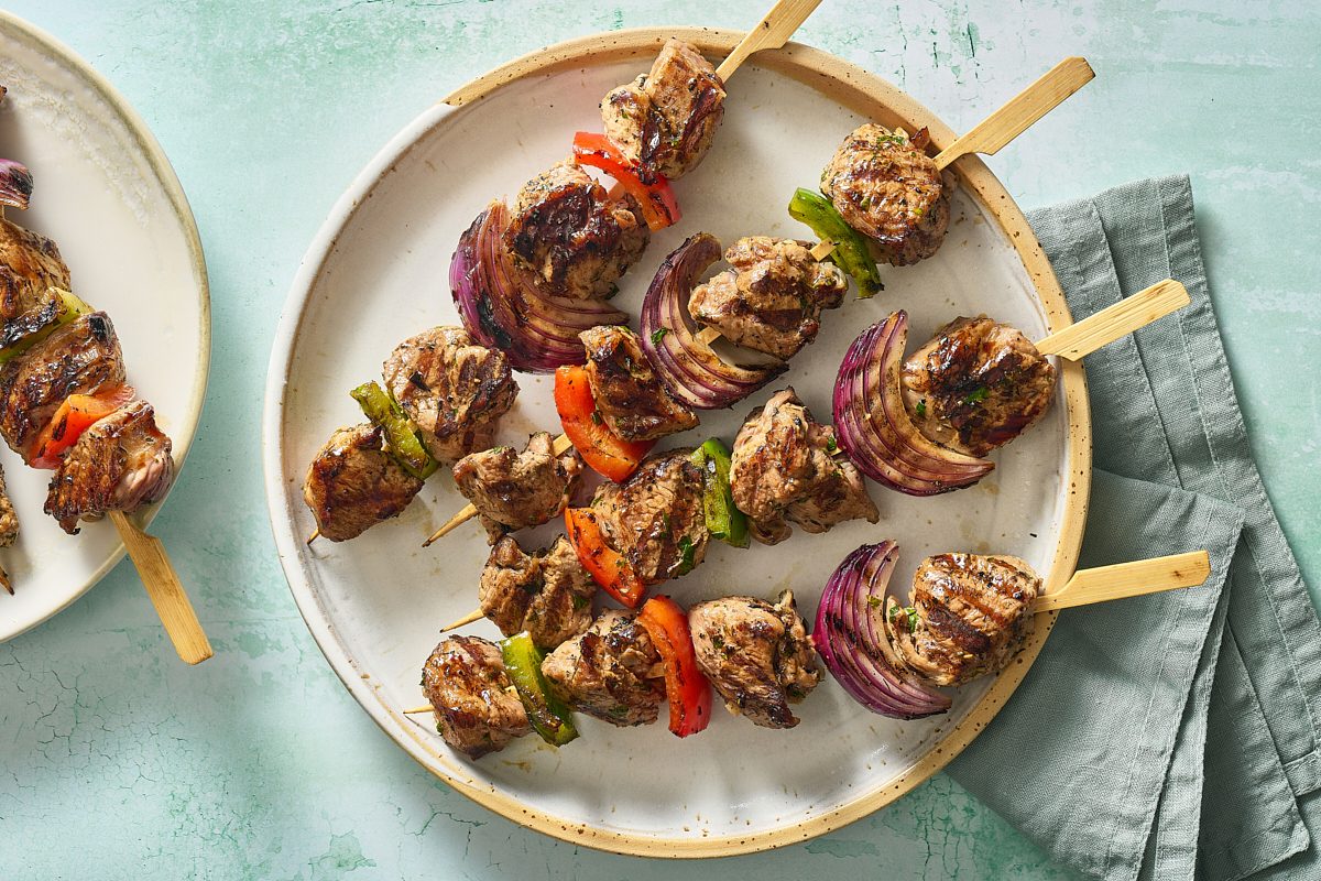 Overhead shot of lamb kabobs on a plate