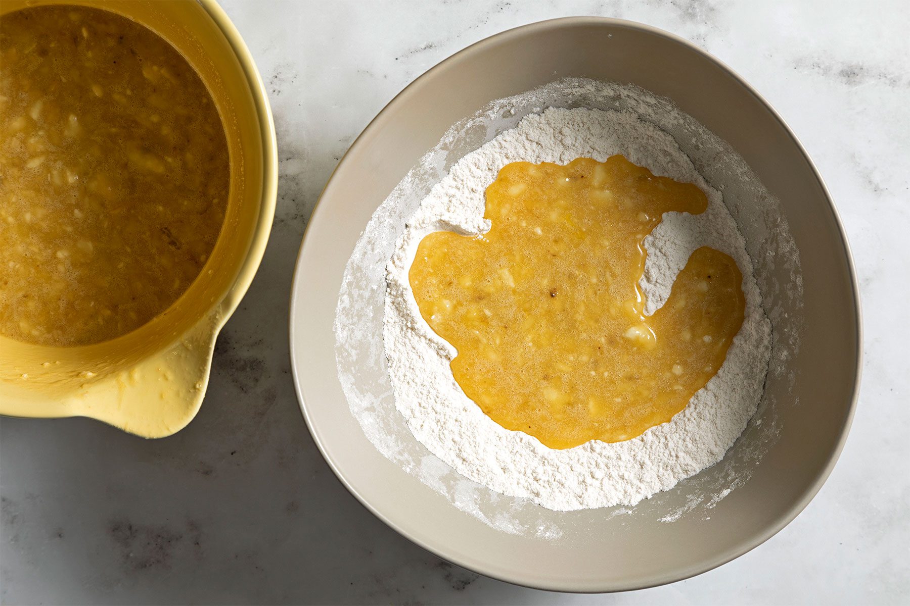 ovrehead shot of eggs mixed in flour