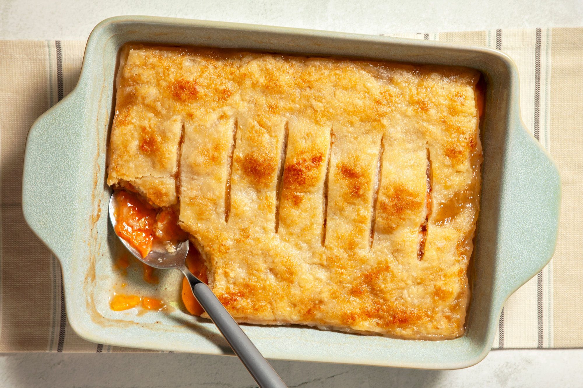 overhead shot of sweet potato cobbler in a baking dish