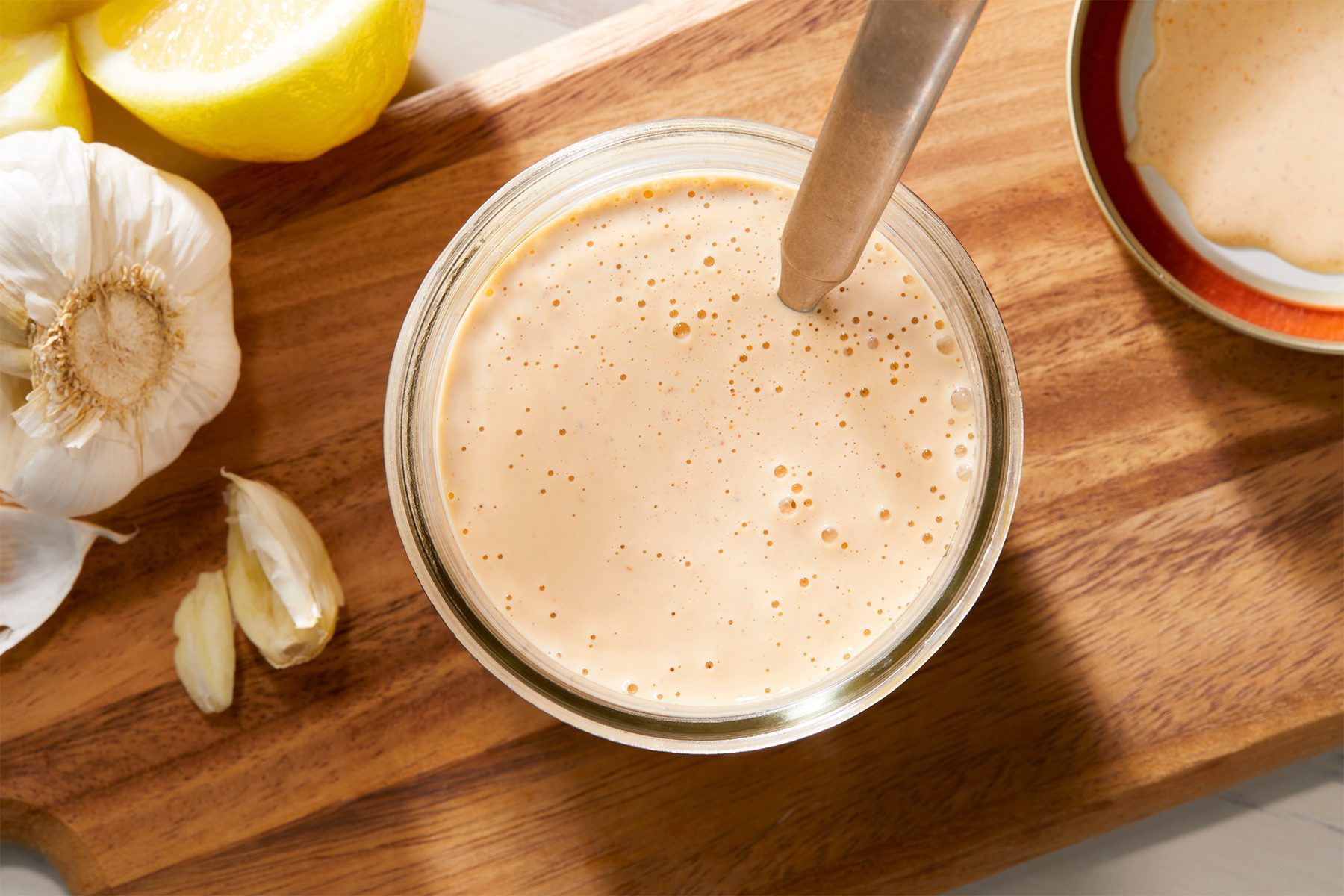 overhead shot of tahini dressing in a jar