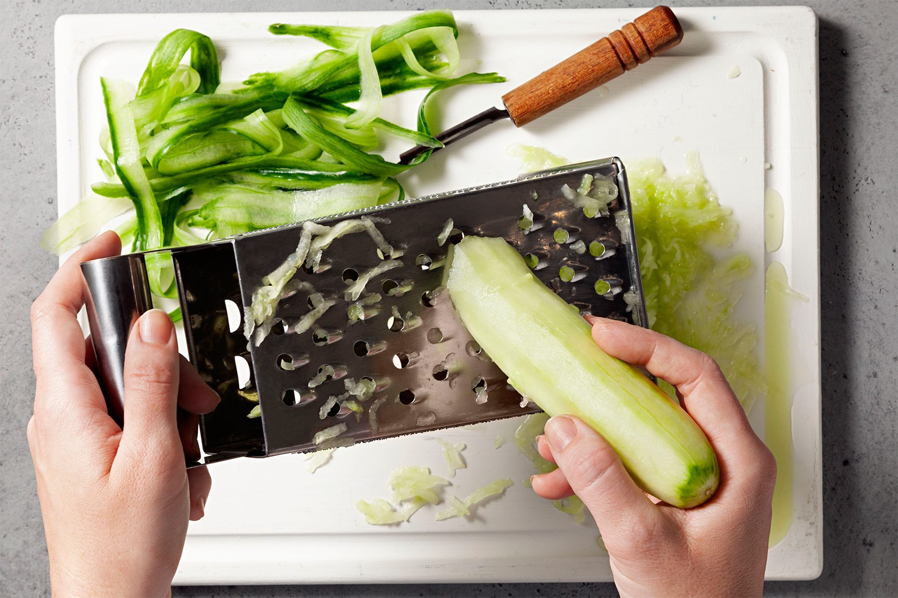  grated cucumber on white tray