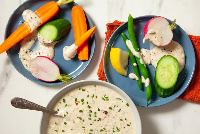 Two plates of fresh veggies served with Vegan Ranch Dressing