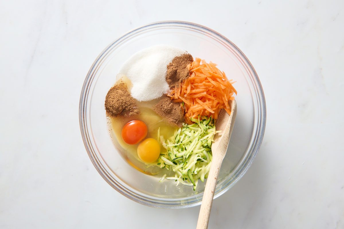 All The Vegtable And Eggs And Sugar In a Bowl About To Get Mixed