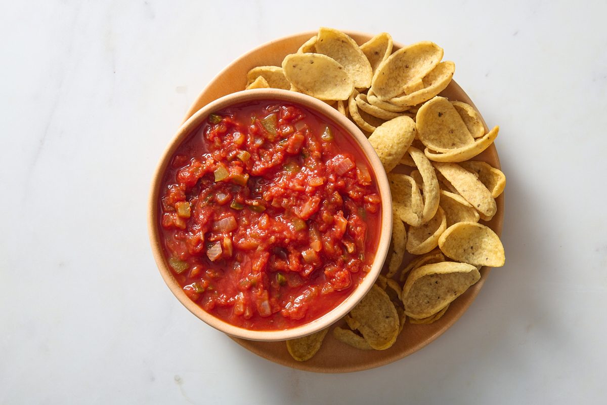 Serving the chunky salsa with tortilla chip scoops