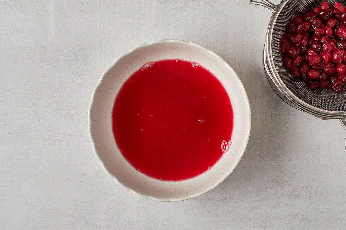 Cook cranberries and strain.