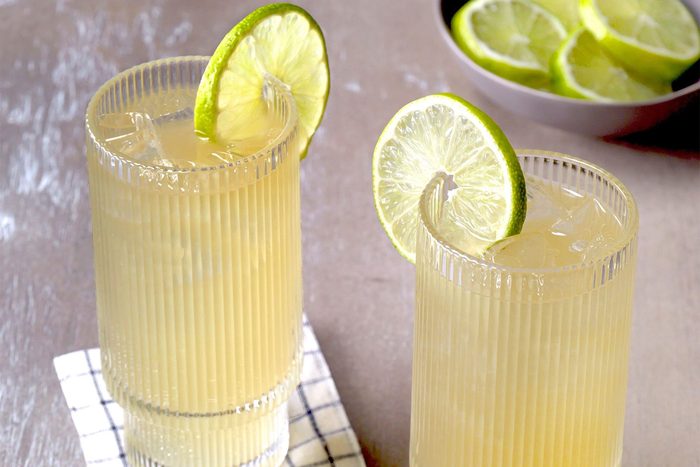 3/4th shot; Dark n' Stormy in two glasses with two lemon slices