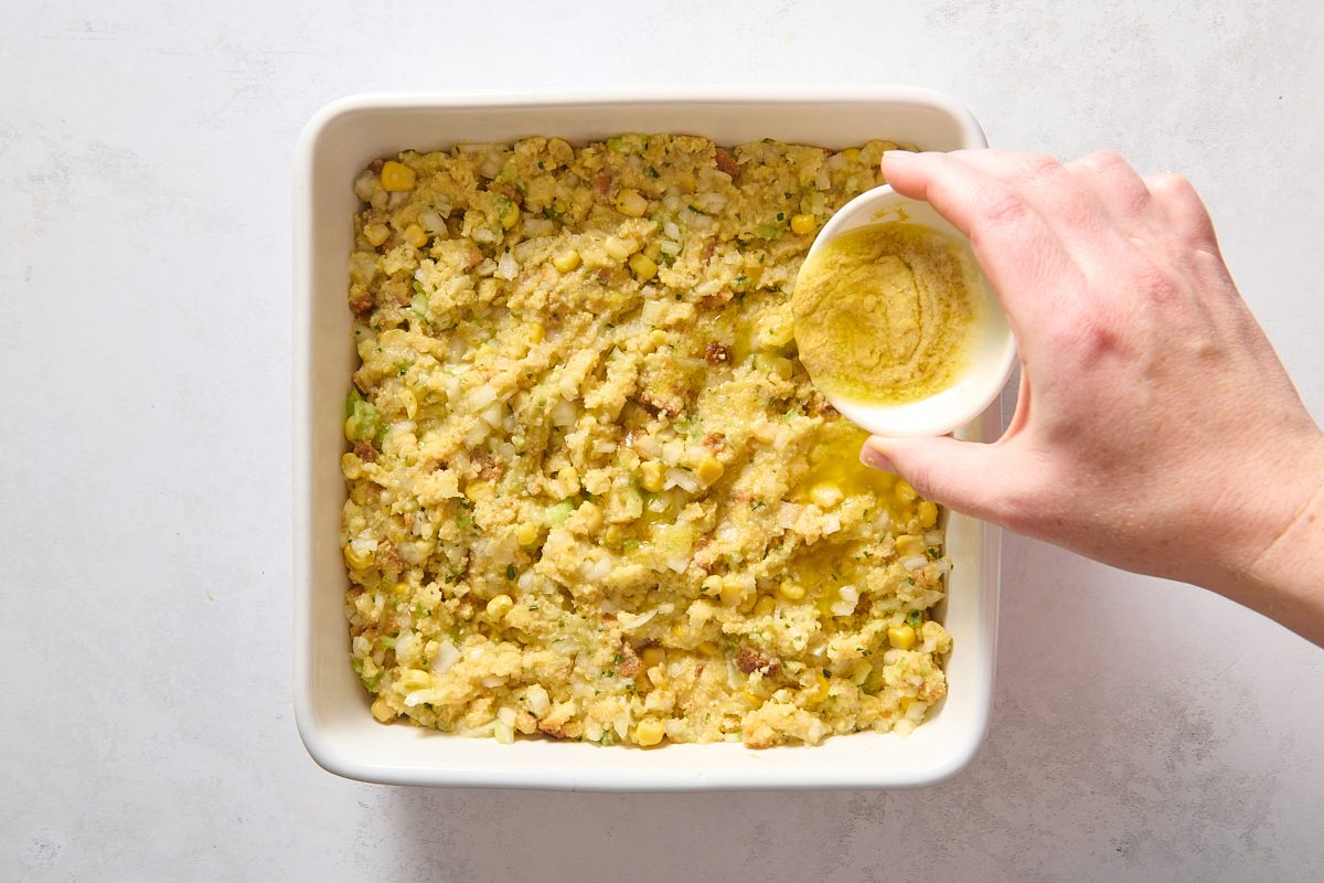 Drizzling butter and mustard over the dressing