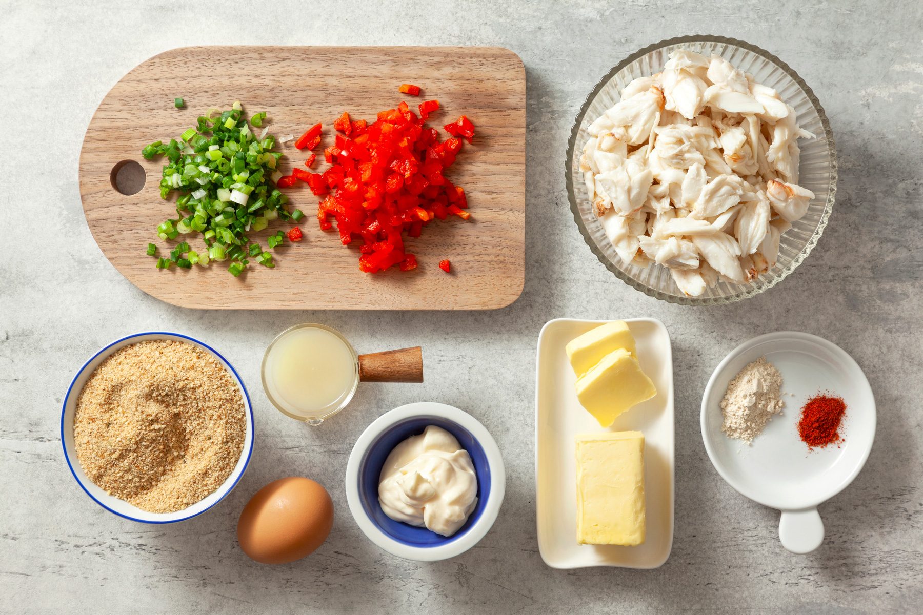 Crabmeat, bread crumbs, green onion, red bell pepper, and other ingredients for Easy Crab Cakes