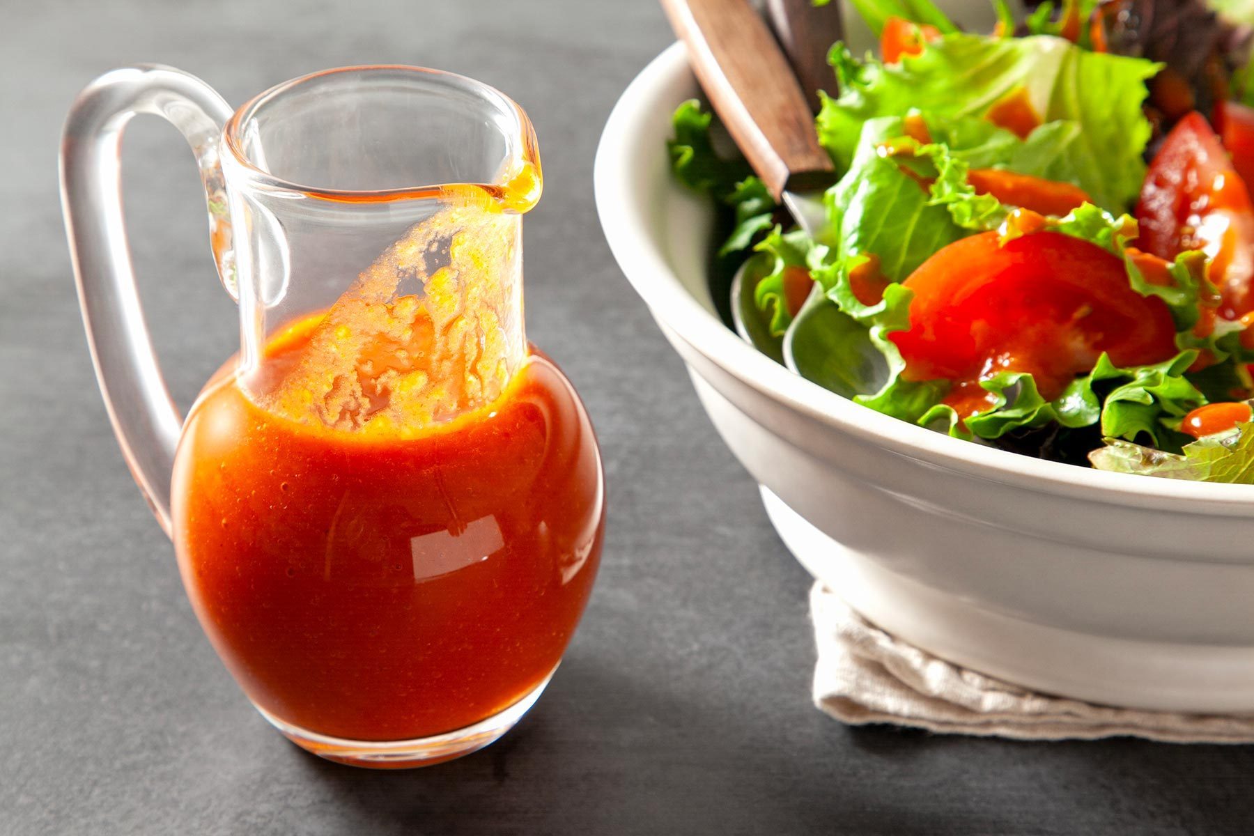 wide shot of classic french dressing served with green salad