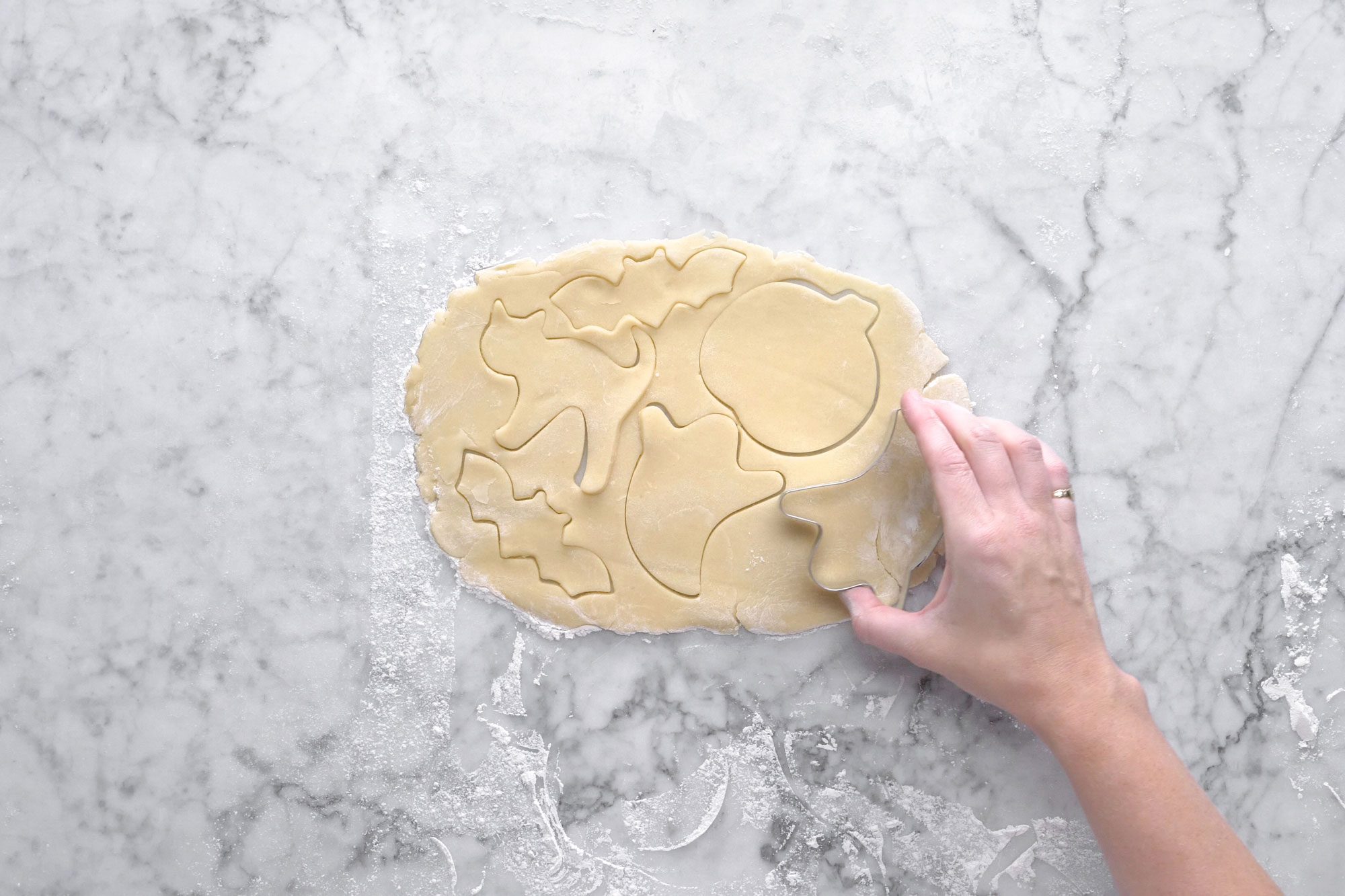 Cut the cookies with halloween shaped cookie cutter