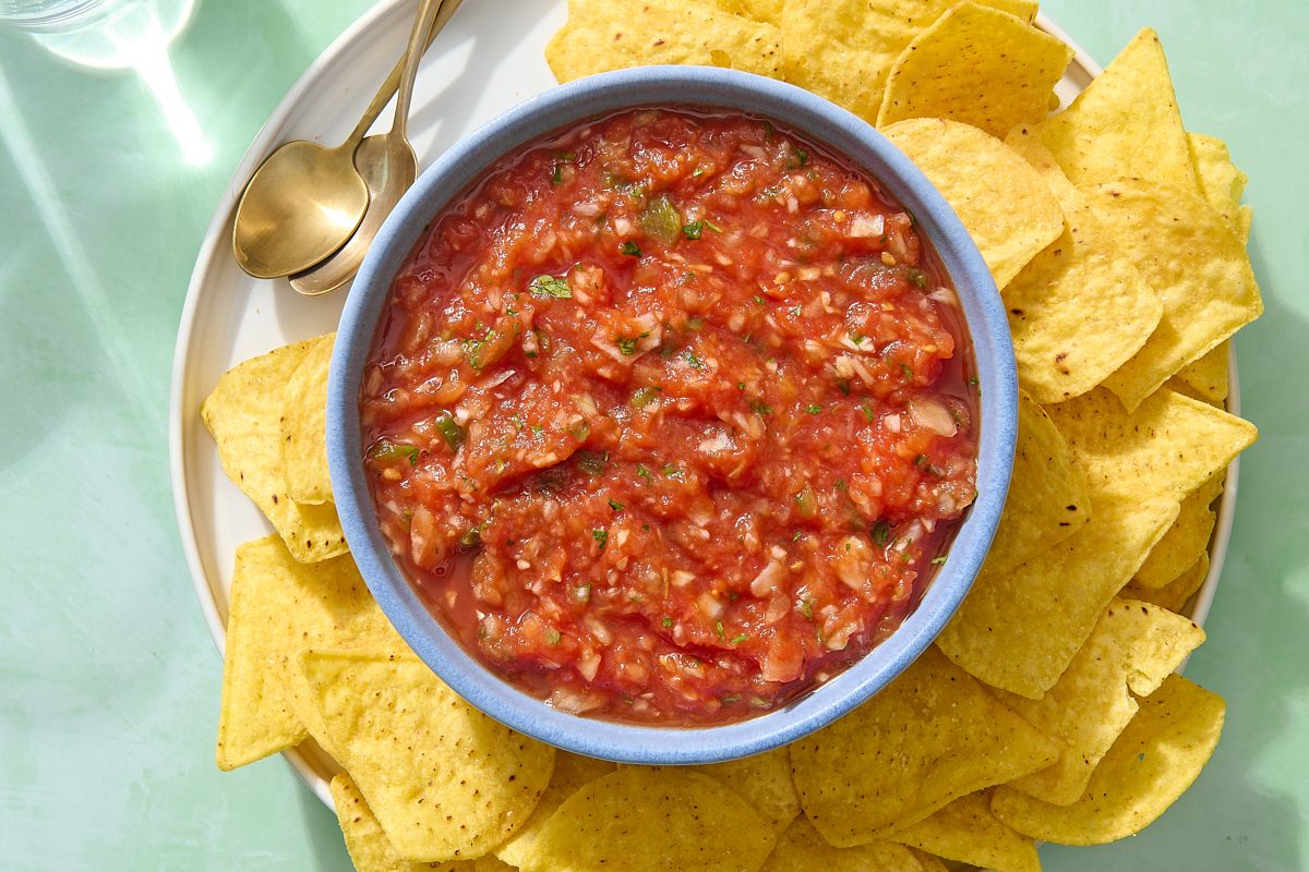Overhead shot of homemade Mexican salsa in a bowl with chips