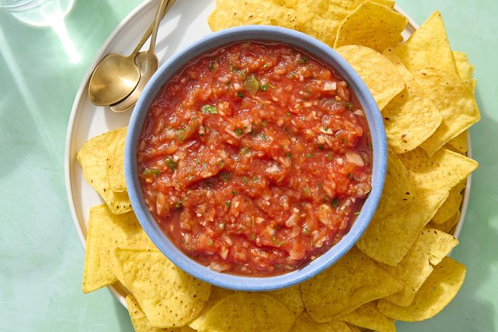 Overhead shot of homemade Mexican salsa in a bowl with chips