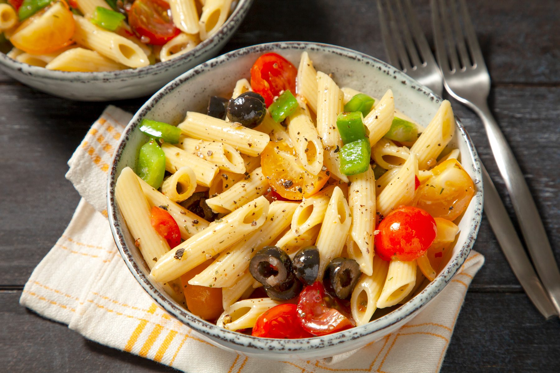 Penne Pasta Salad with green capsicum, olives and cherry tomatoes