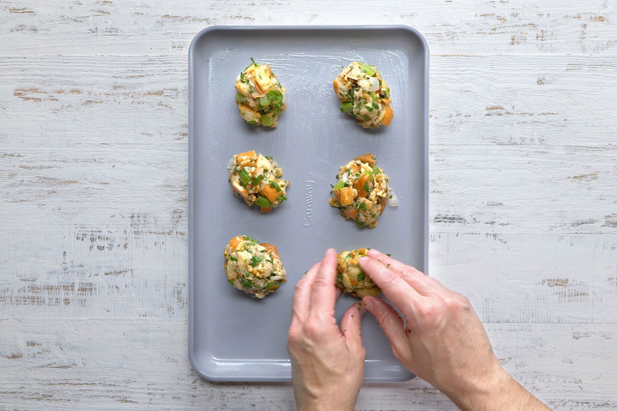Stuffing balls in a greased baking sheet