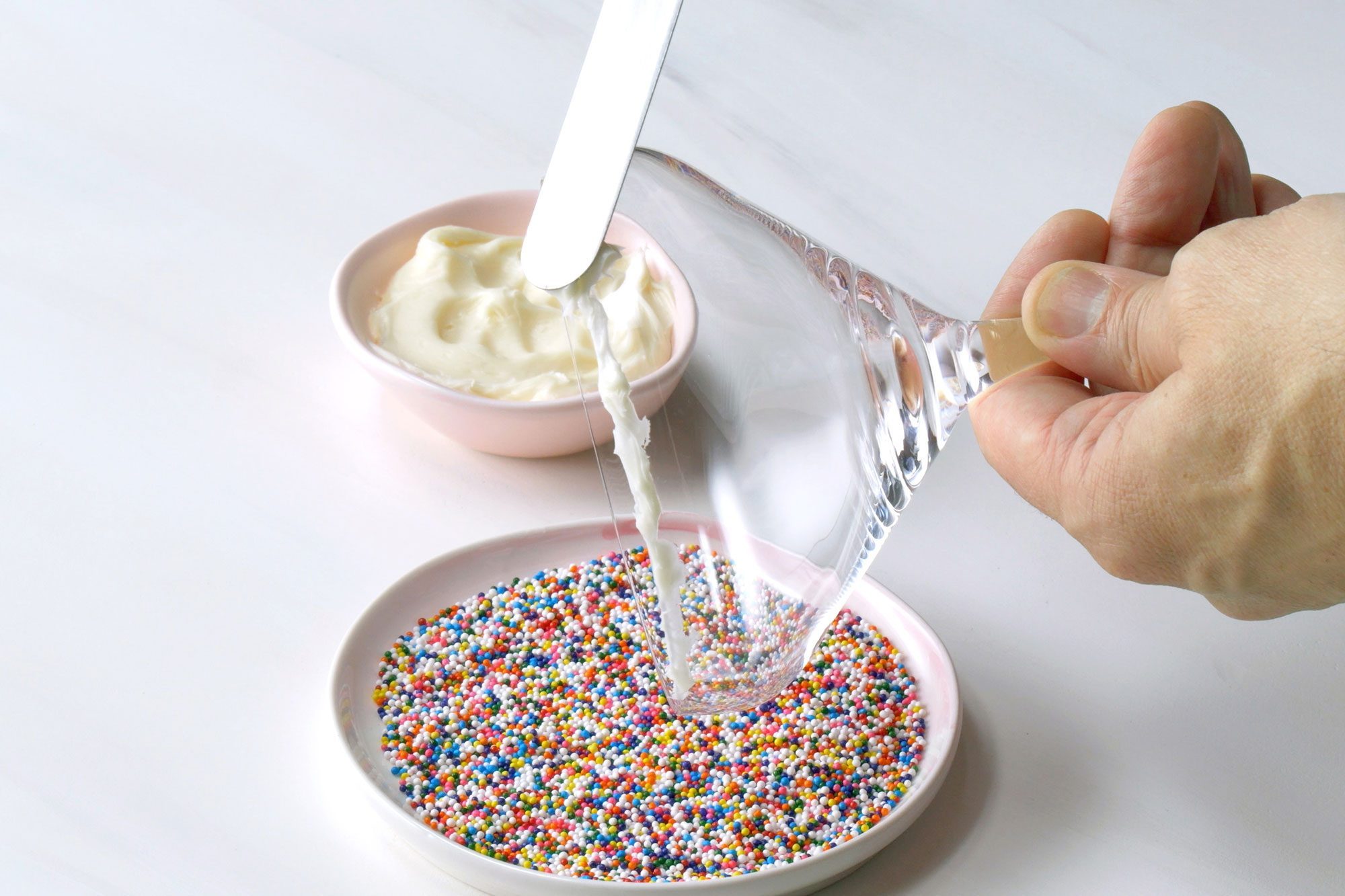 Rim the martini glass with the vanilla frosting