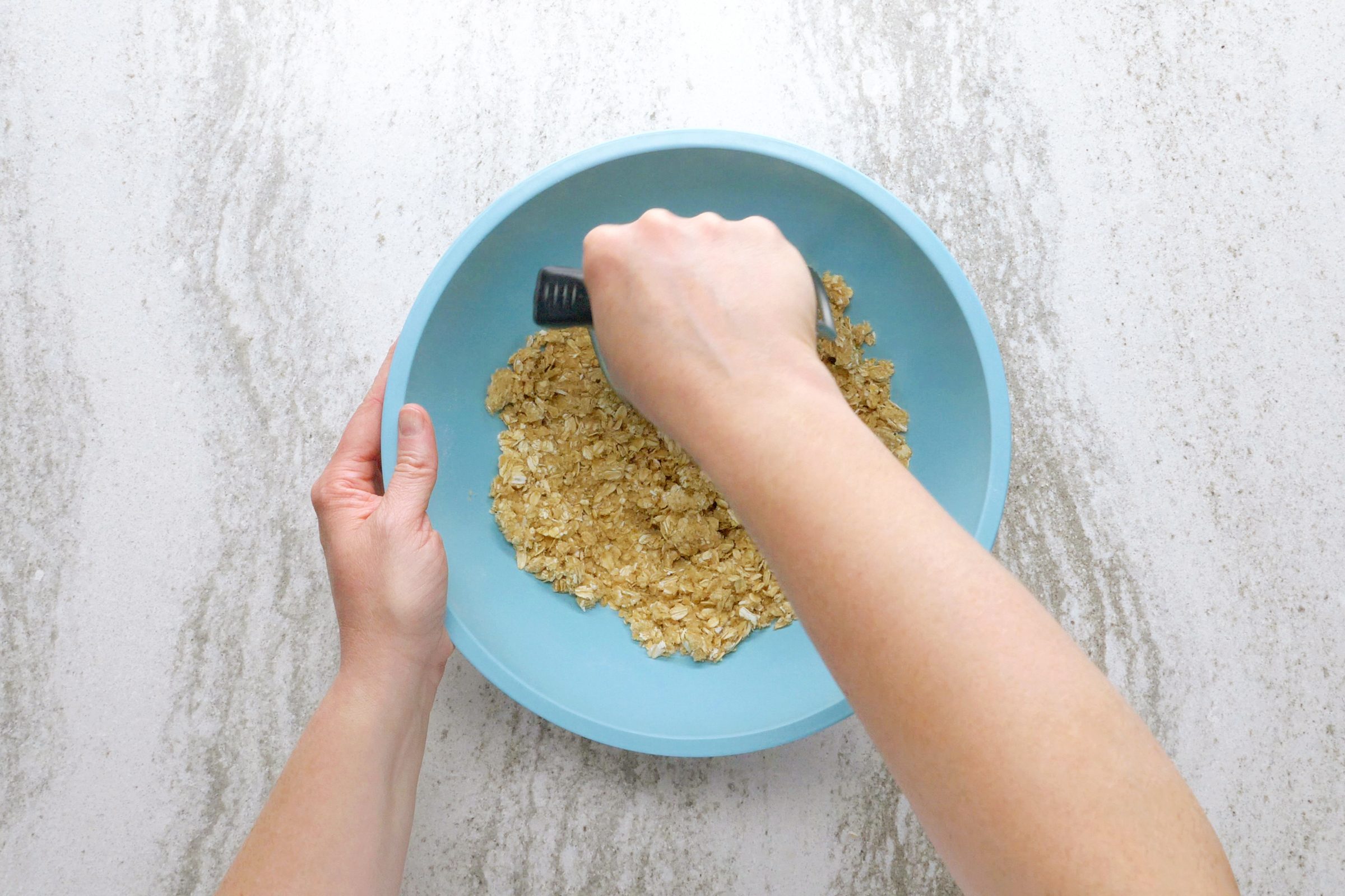 making crumble to top the peach crisp with