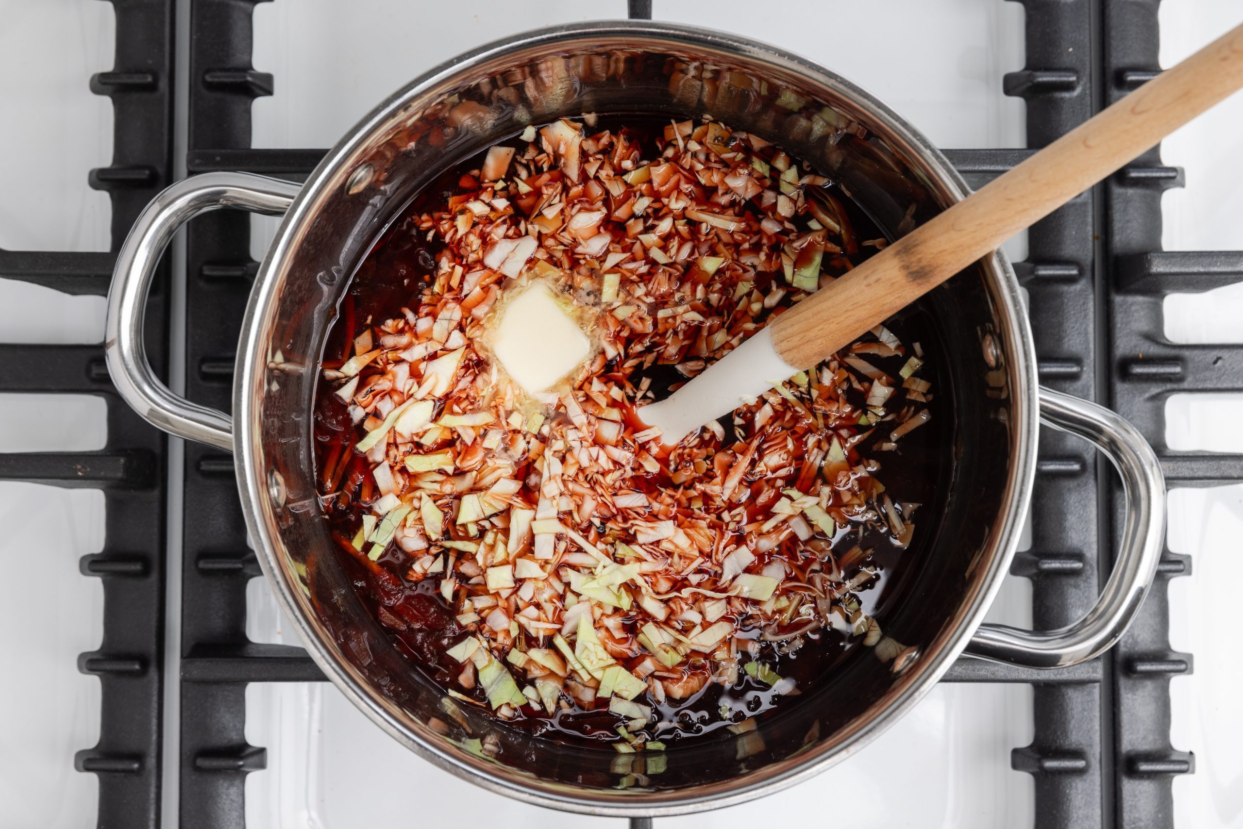 Beef broth, cabbage and butter added to the carrots and beets mix.