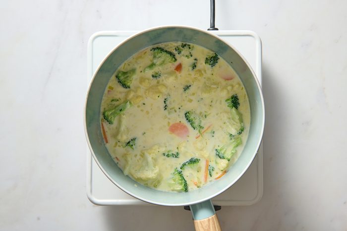 Milk added to vegetables in the pan
