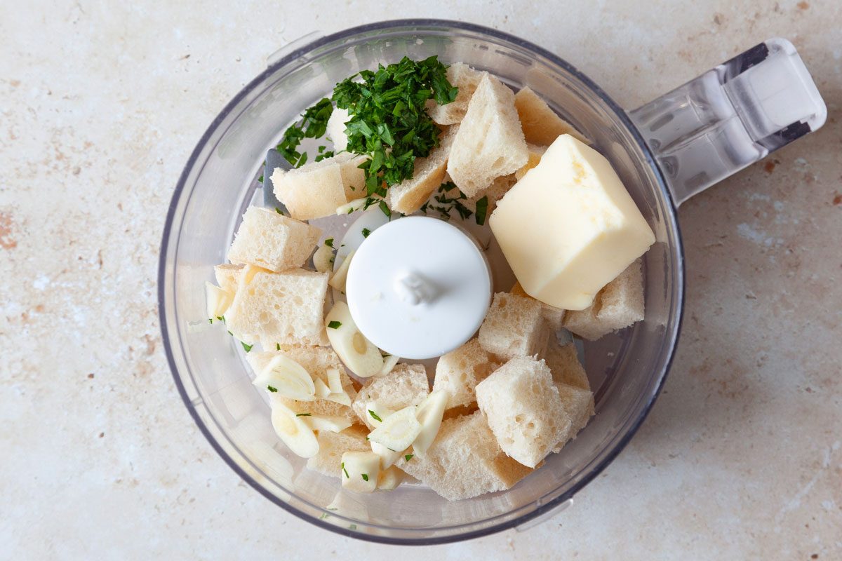 Step 2 of Taste of Home Brussels Sprouts au Gratin is to pulse the bread. butter, garlic and parsely in a food processor ot make breadcrumbs