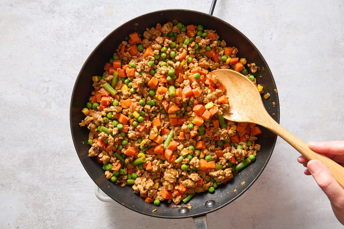 Adding vegetables to the skillet