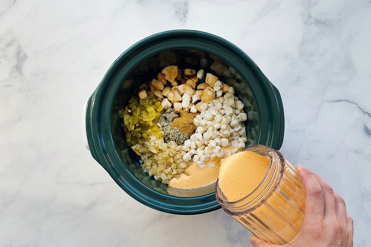 How to Make Hominy Soup, step 3 add sauce along with chicken, vegetables, hominy, green chiles and spices in a slow cooker