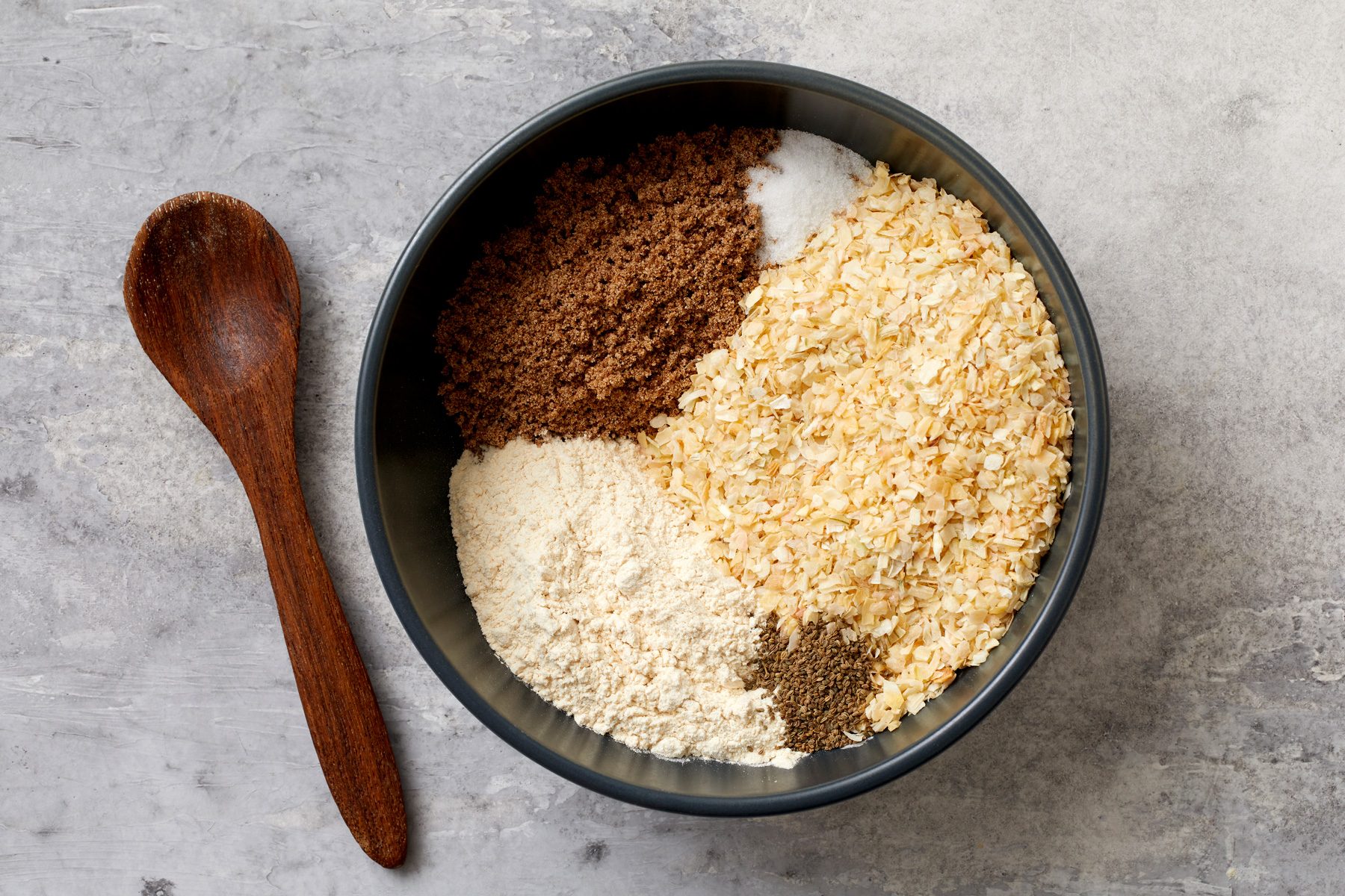 Pour the minced onion, beef bouillon granules, onion powder, sugar and celery seed into a small bowl