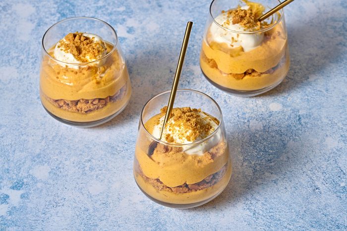 Three individual serving glasses of pumpkin mousse
