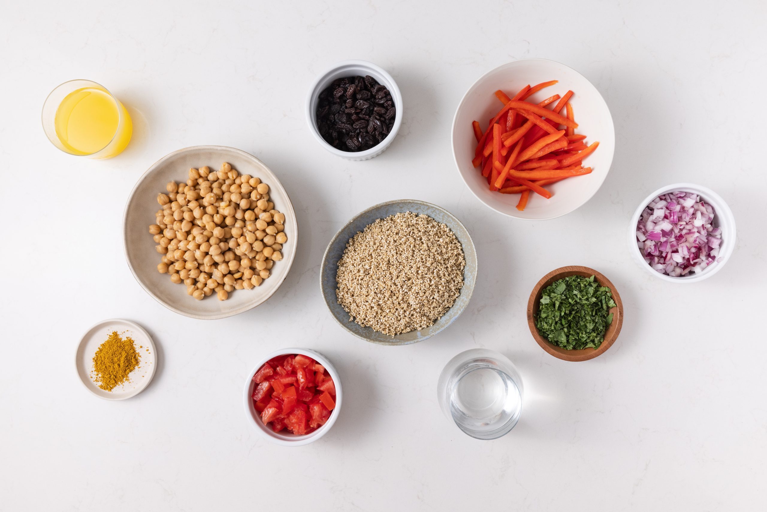 Ingredients for quinoa chickpea salad on kitchen counter.