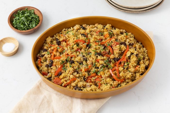 Quinoa chickpea salad served on ceramic serving dish.