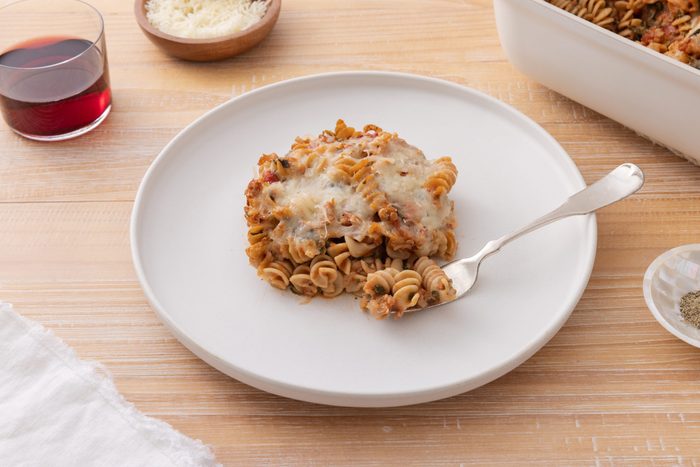 Pasta bake served on plate with fork.