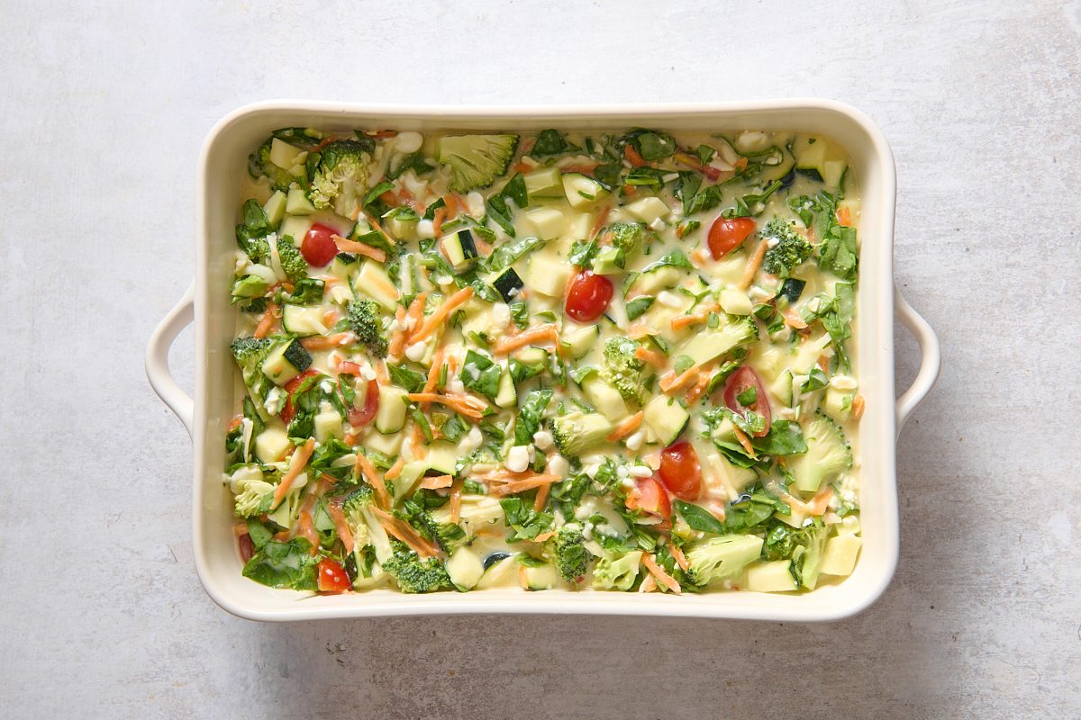 Casserole poured into a baking dish ready for the oven