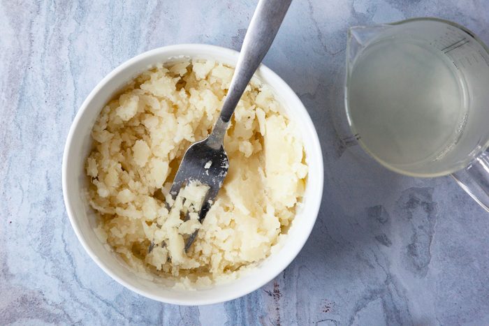 Step 1 of Taste of Home Amish Cinnamon Rolls is to boil and mash the potatoes, reserving 1/2 cup of the water used to cook the potatoes