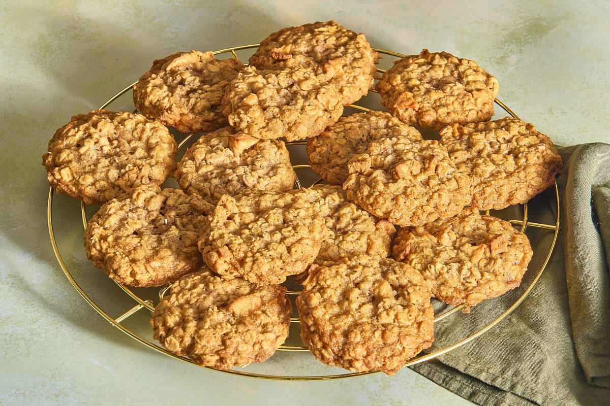 Wire rack filled with a pile of apple oatmeal cookies
