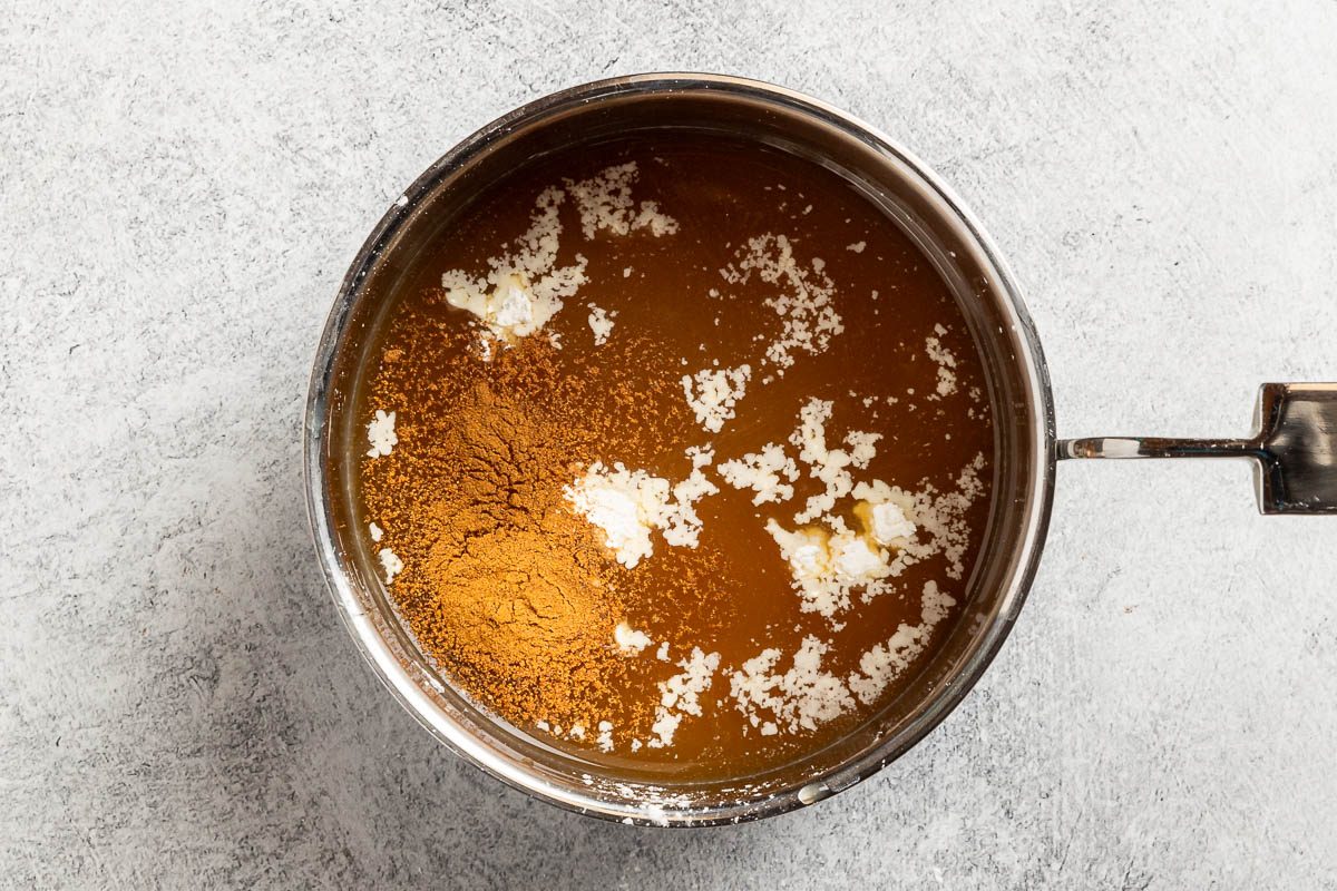 Taste of Home Apple Syrup recipe photo of combining the first four ingredients and bringing to a boil until thickened.