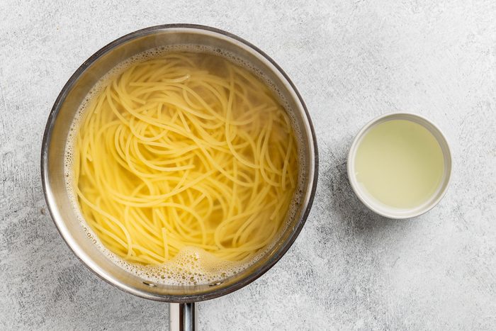 Taste of Home Avocado Pesto recipe photo of the cooked pasta with a half cup of the water reserved.