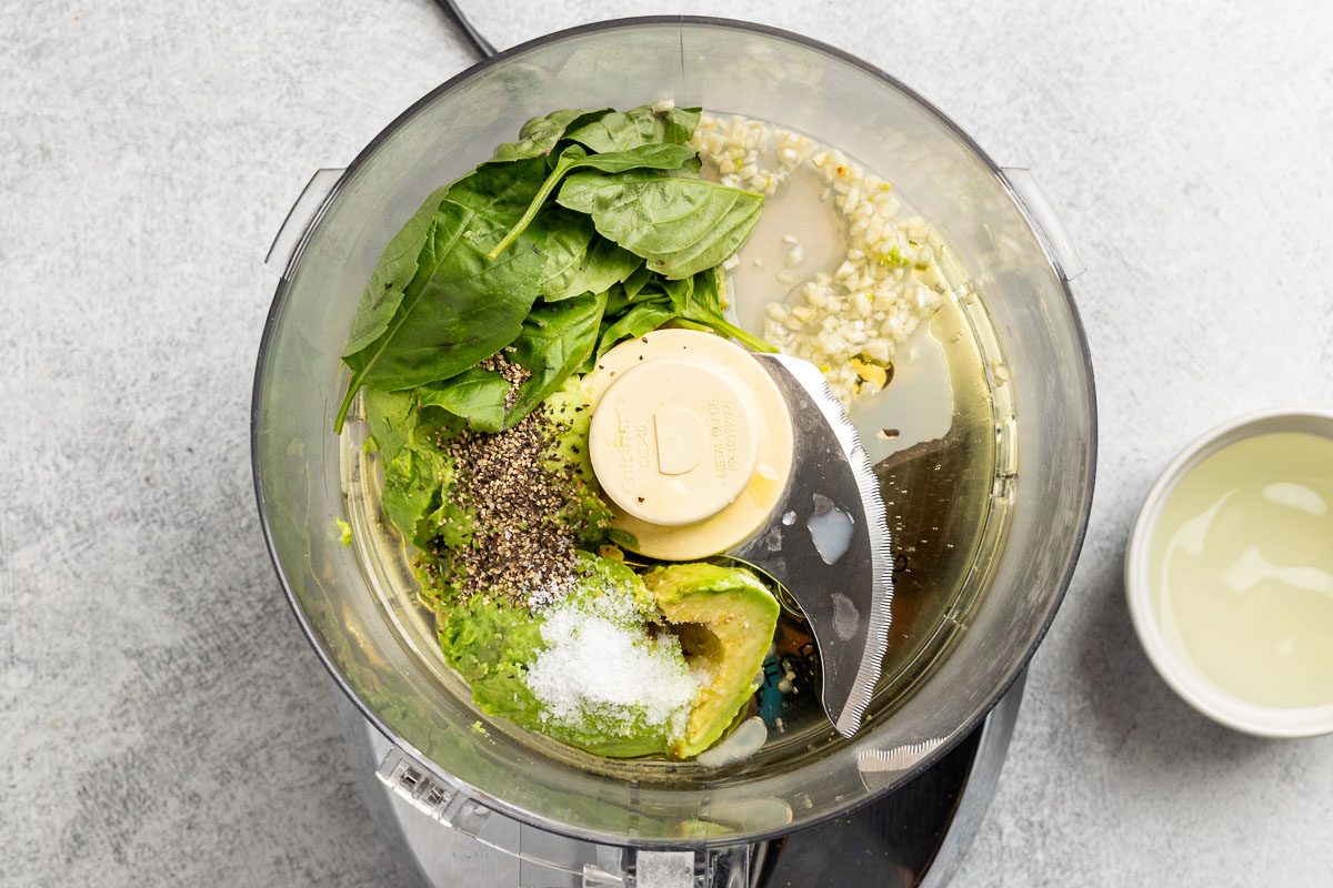Taste of Home Avocado Pesto recipe photo of pesto ingredients in a food processor.