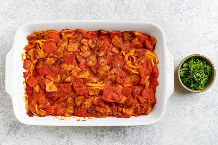 Taste of Home Bacon Pasta recipe photo of the pasta transferred to and baked in a baking dish.