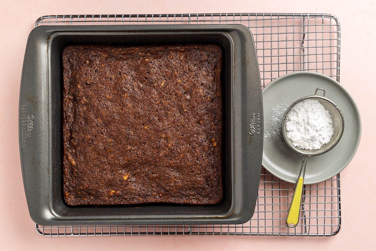 Taste of Home Banana Brownies recipe photo of the baked brownies with confectioners' sugar for serving.
