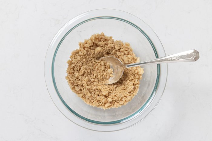 Ingredients for crumb topping being mixed in mixing bowl.