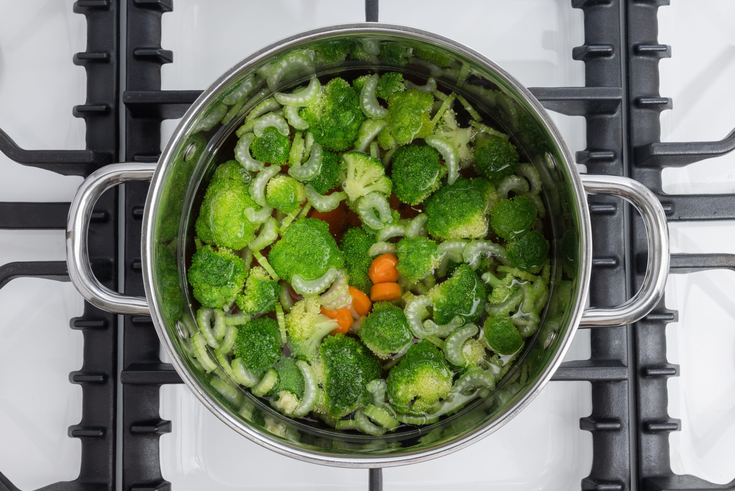 Broccoli, carrots and celery brought to a boil.