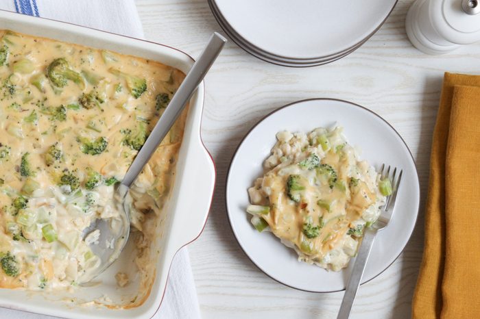 Serving cheesy broccoli rice casserole