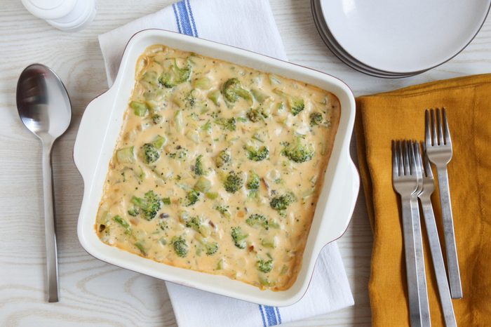 Cheesy broccoli rice casserole in a white casserole dish